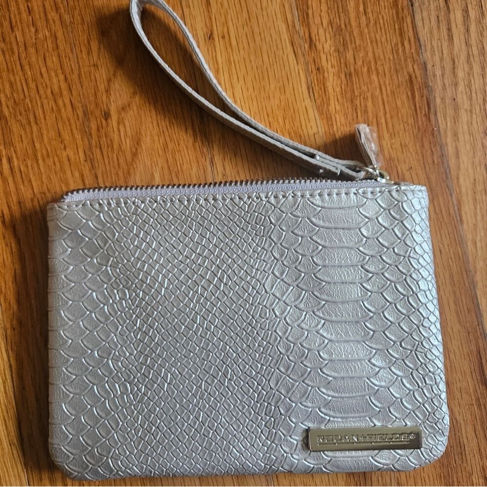 Rodan and fields silver/grey reptile design wristlet/makeup bag. Pink/hot pink